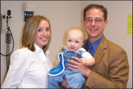 Dr. Girotto and Christine Emerson, P.N.P., with a patient at the Pediatric Cleft and Craniofacial Center at Golisano Children's Hospital.