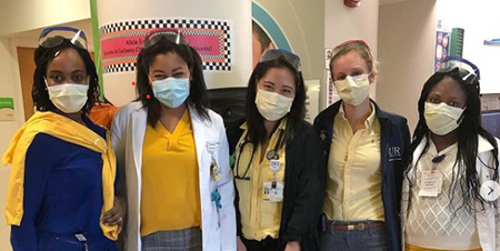 5 masked female medical providers