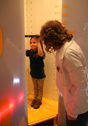 Child standing in EOS X-ray machine