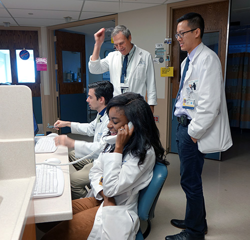 Fellows rounding under the supervision of Department of Medicine Chair, Paul Levy, MD