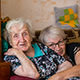Two Elderly Women Smiling at the Camera