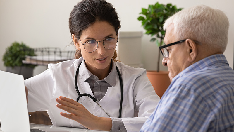 doctor explaining information to older man
