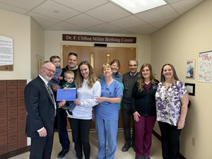 Bryar Collins and family in OB unit