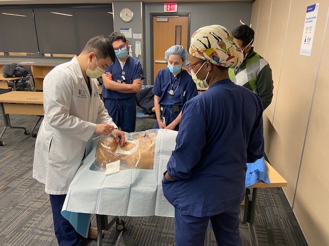 Students learning how to place a central line