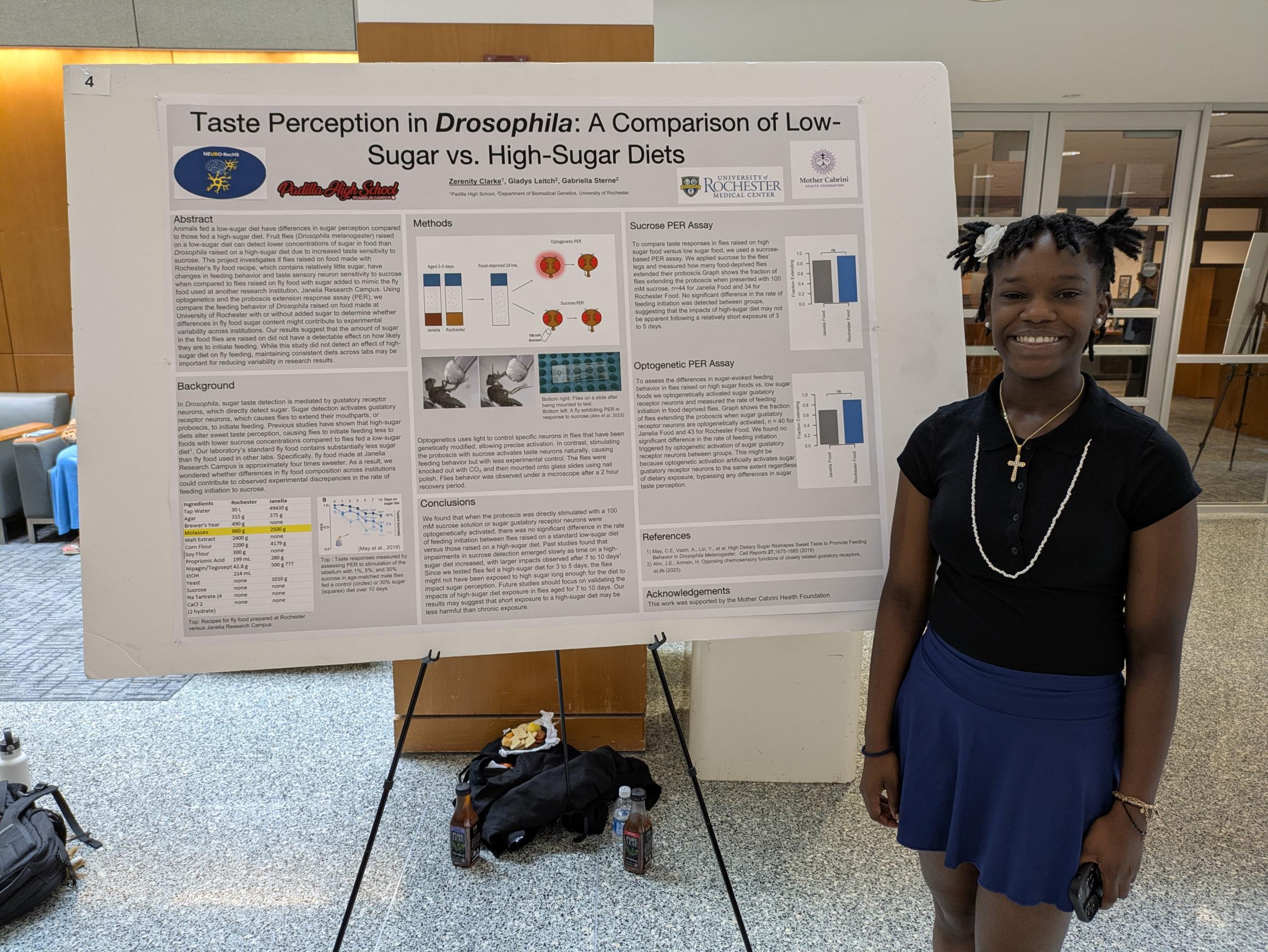 student presents scientific poster