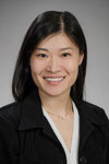Headshot of Dr. Hitomi Sakano in white shirt and black jacket