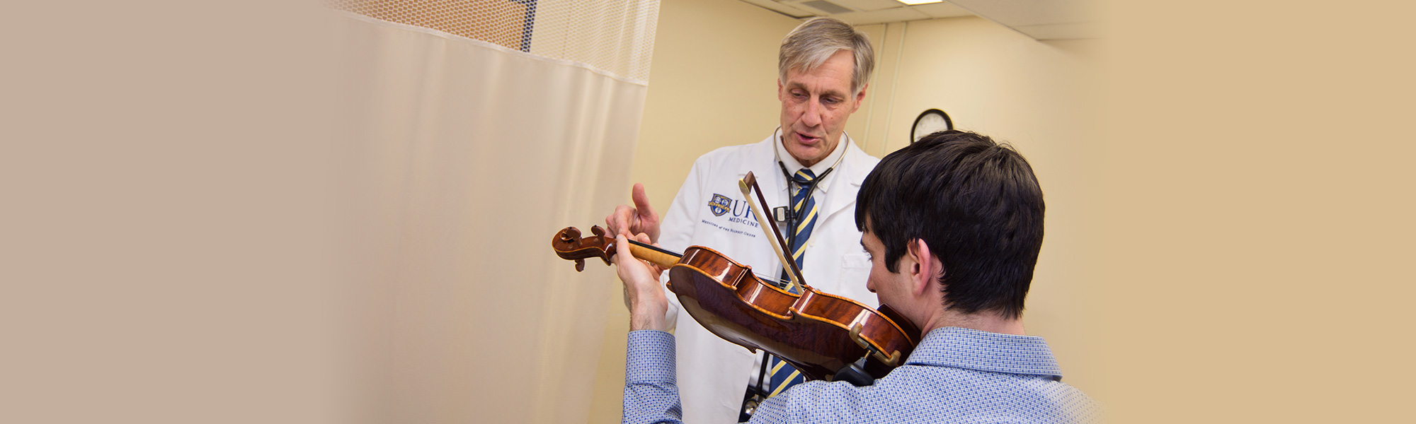 Patient Playing Violin for a Doctor