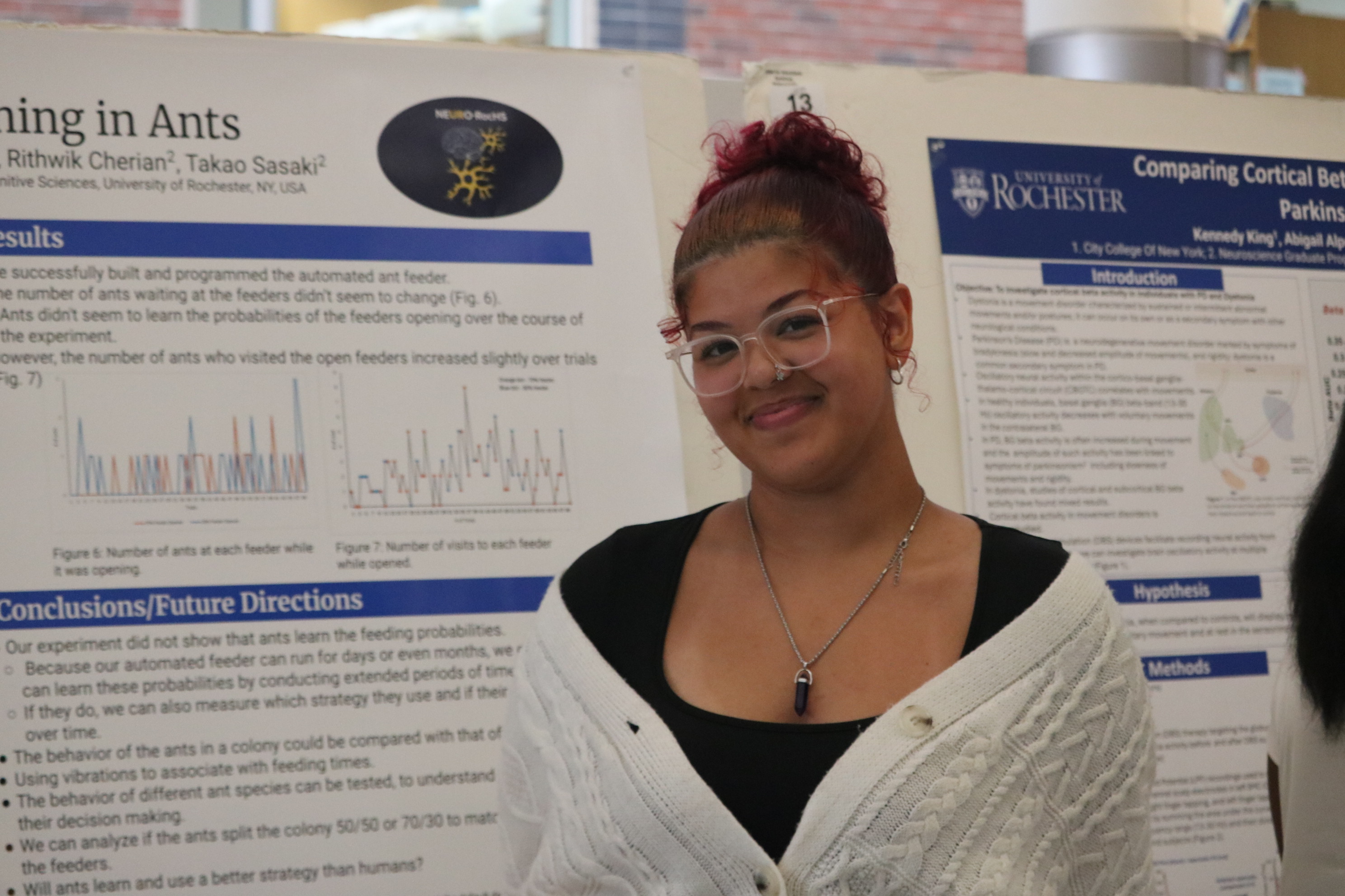 student with scientific poster