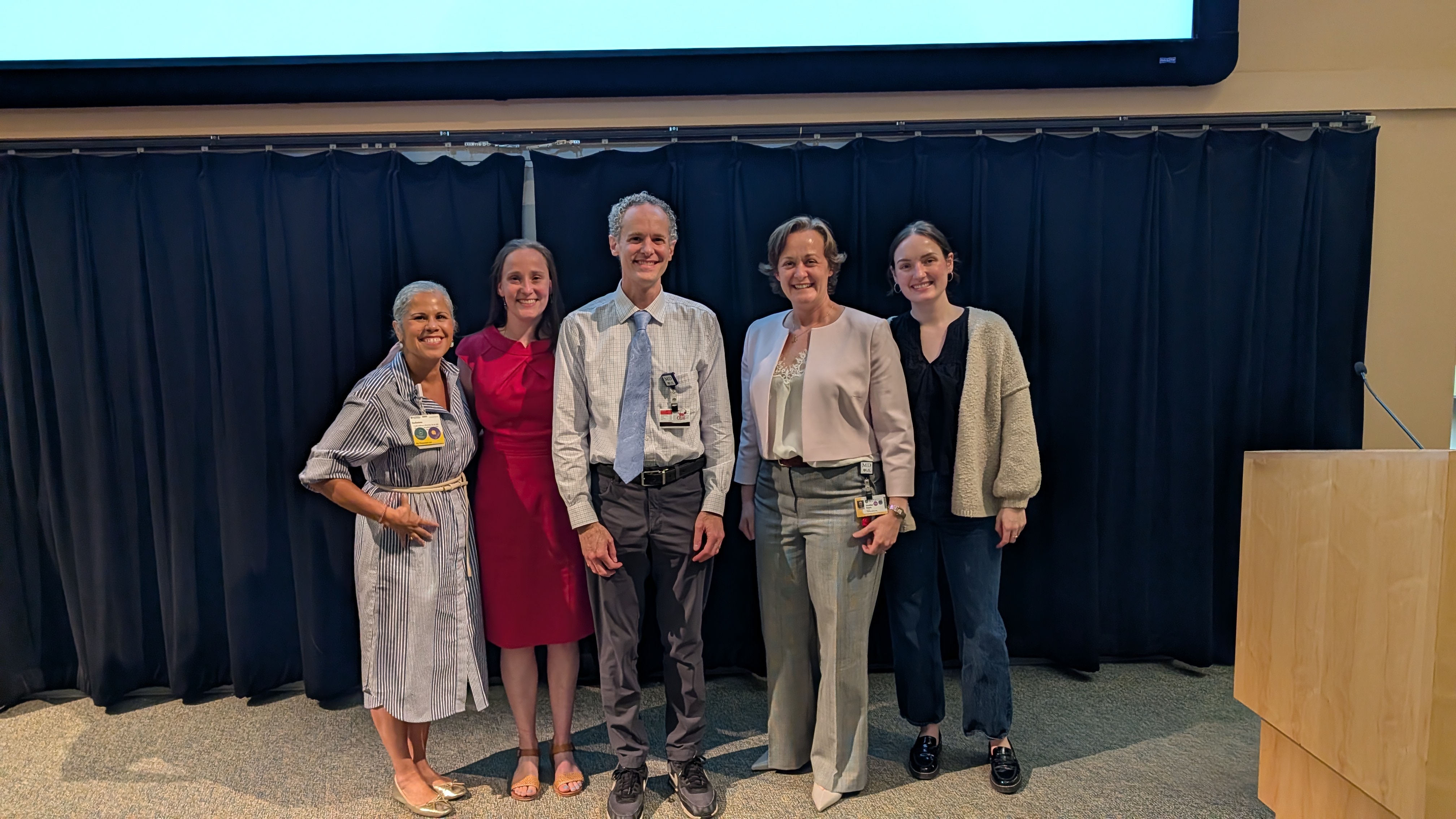 Dr. Stone stands with Health Lab members after his presentation.