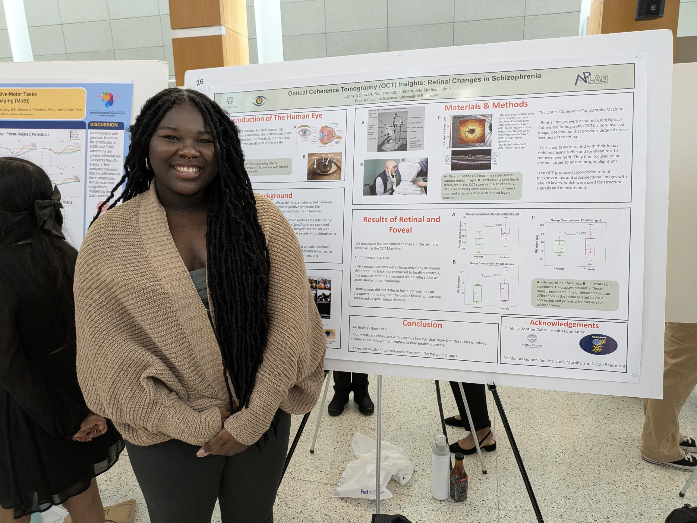student presents scientific poster