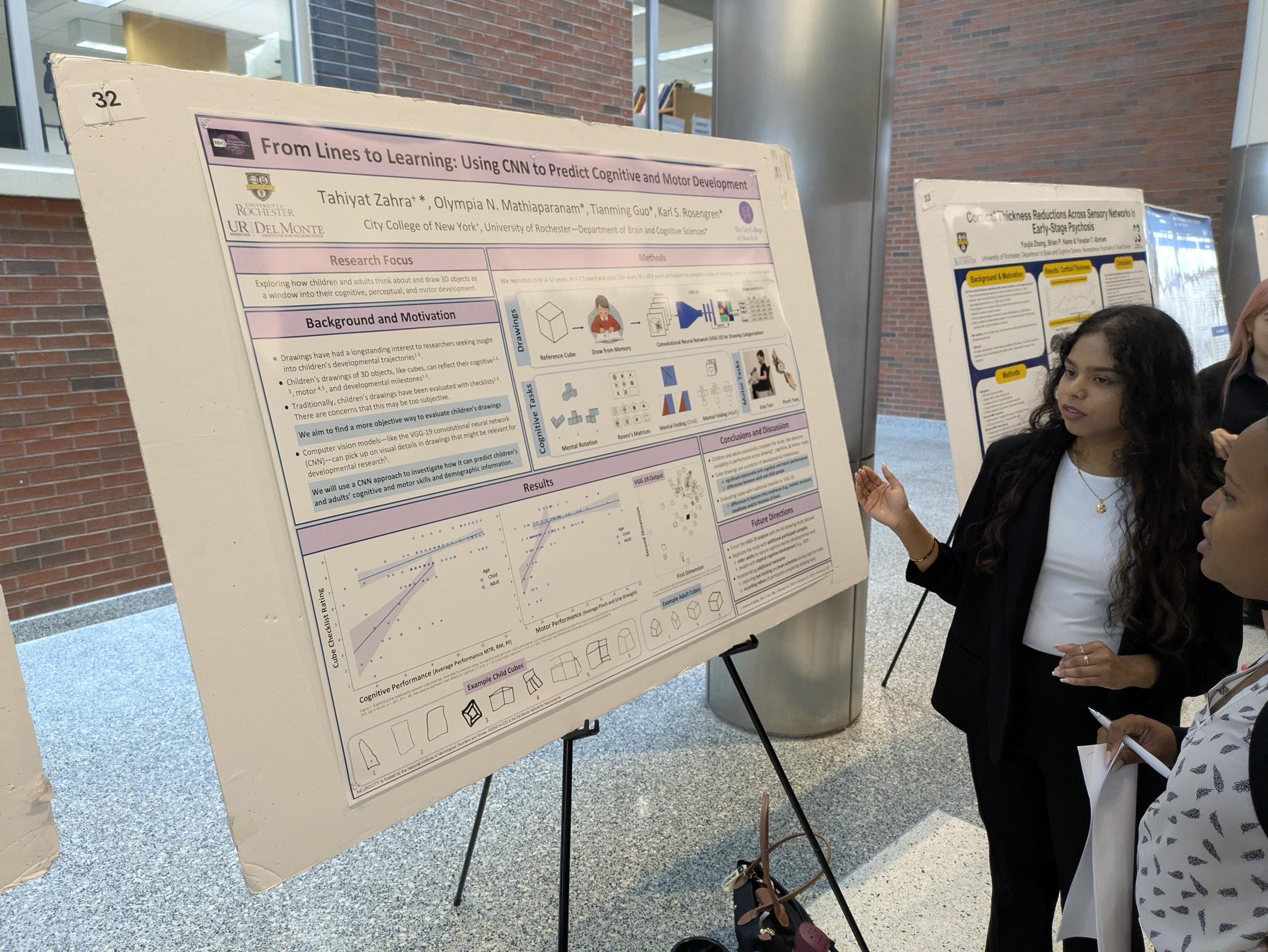 student presents scientific poster