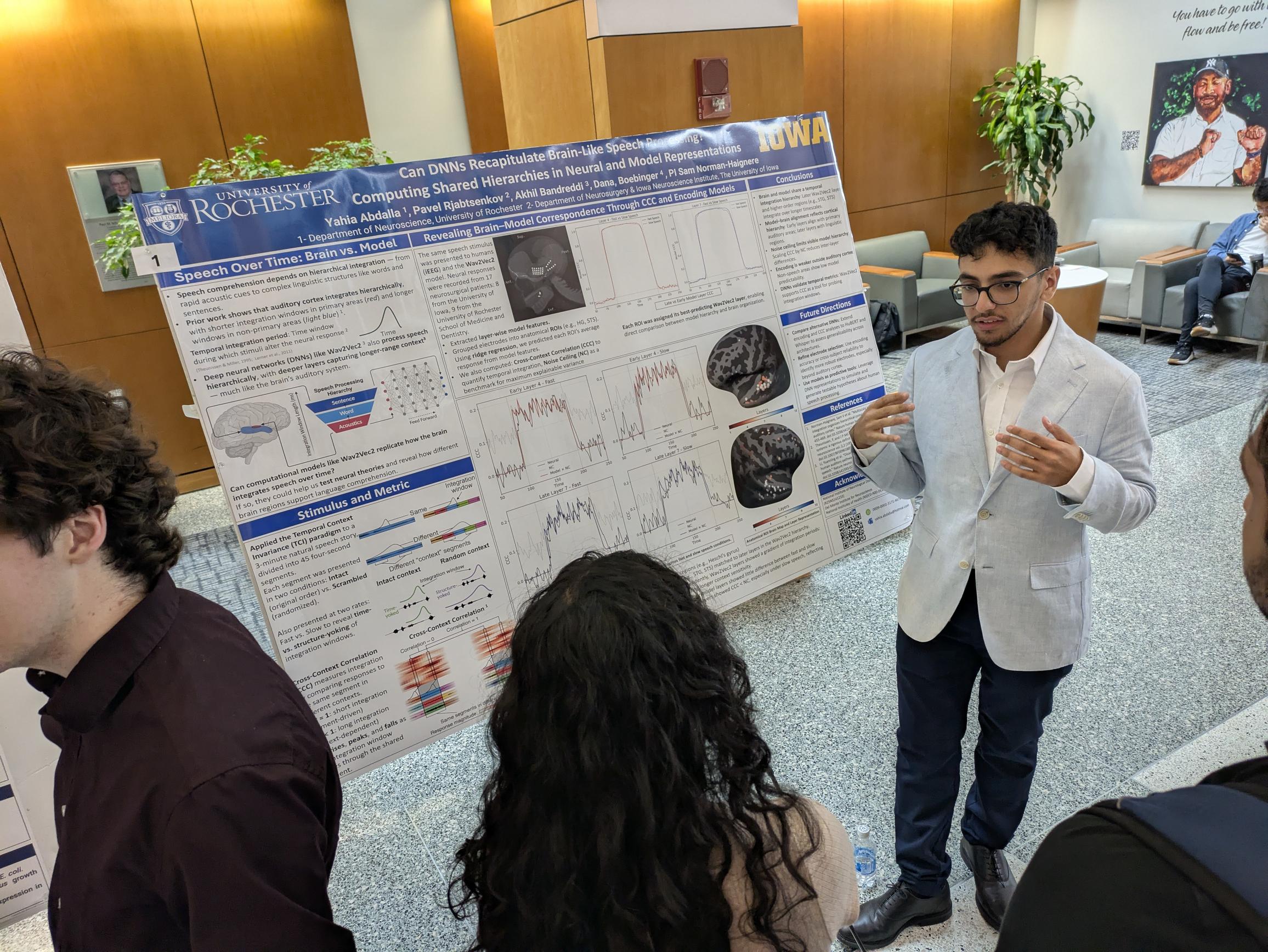Student presenting scientific poster