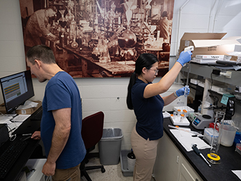 Two people in a lab space.