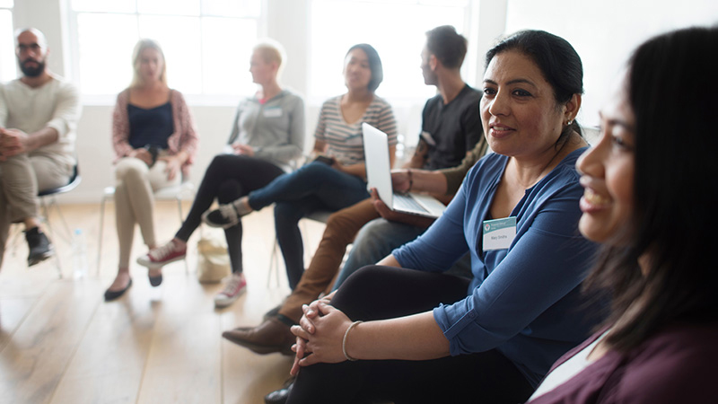 Group of people sitting in chairs