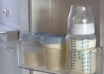 Bottled breastmilk in a refrigerator