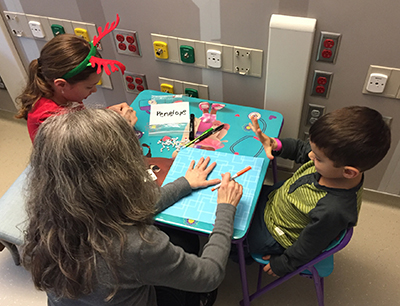 children making cards with child life