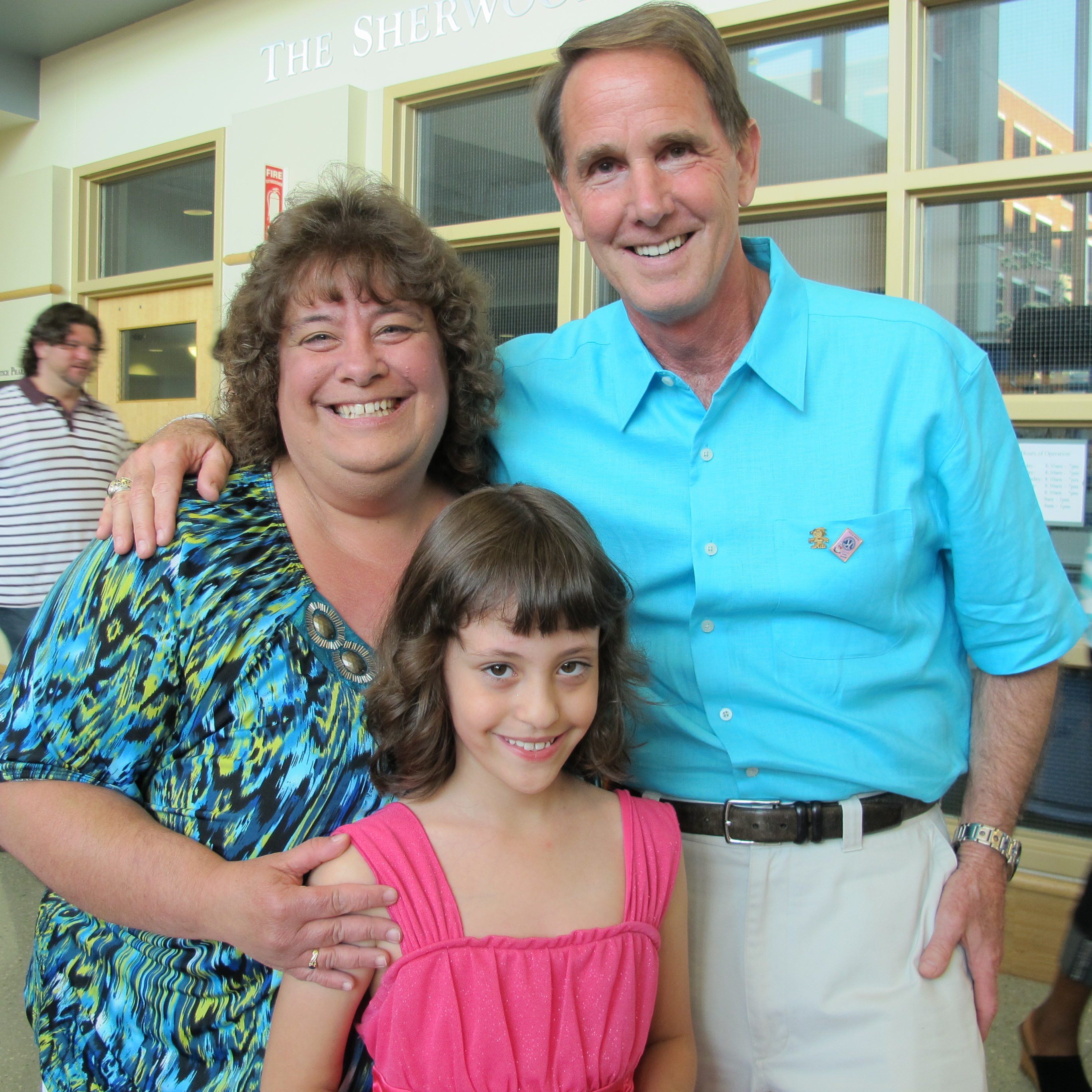 Tricia White with daughter Jamie and friend and board chair Mark Siewert
