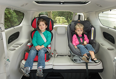 Two kids in forward facing car seats