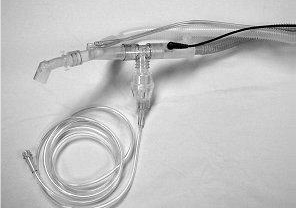 Nebulizer attached to T-piece,which is in line with the ventilator circuit