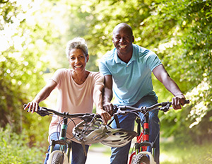 Smiling couple riding bikes