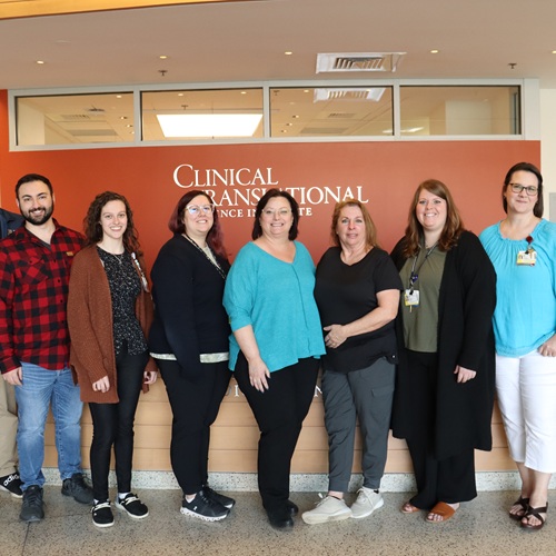 OCR staff pose in front of CTSI offices