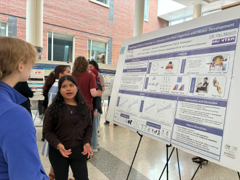 Student presenting scientific poster