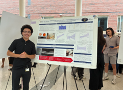 student presents scientific poster