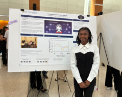 student with scientific poster