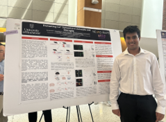 student presents scientific poster