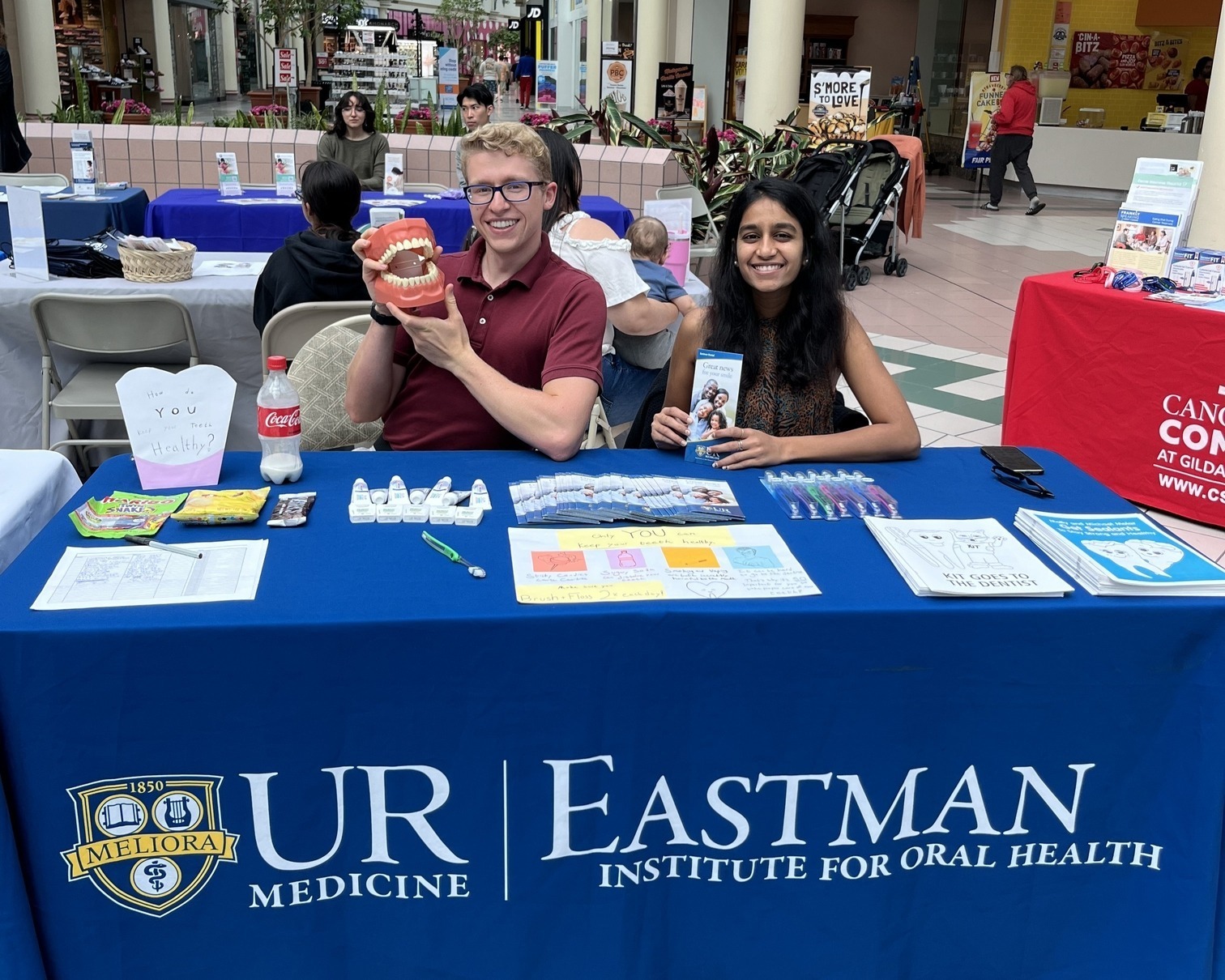 An informational table set up in a mall.