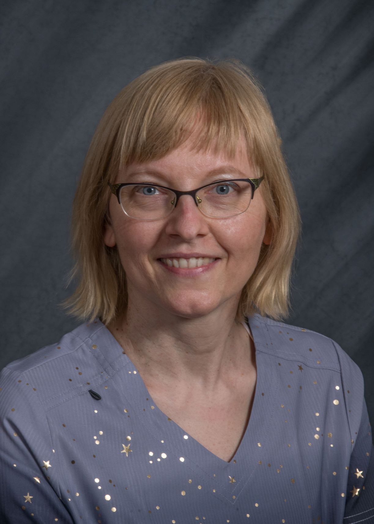 A portrait of Dr. Szilvia Arany