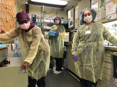 Three dental assistants in the Sterilization Room