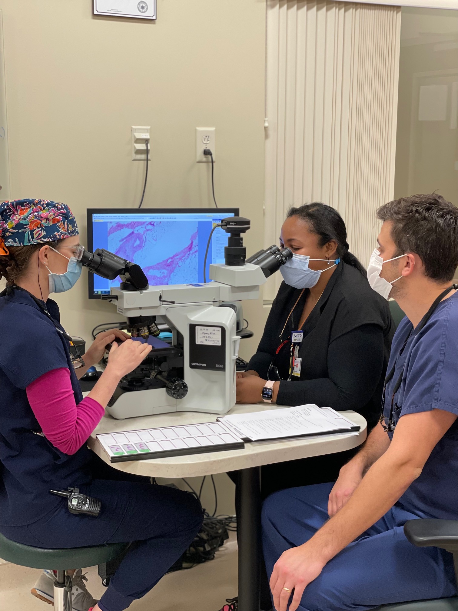 Dr Lambert with fellows discussing tumor options