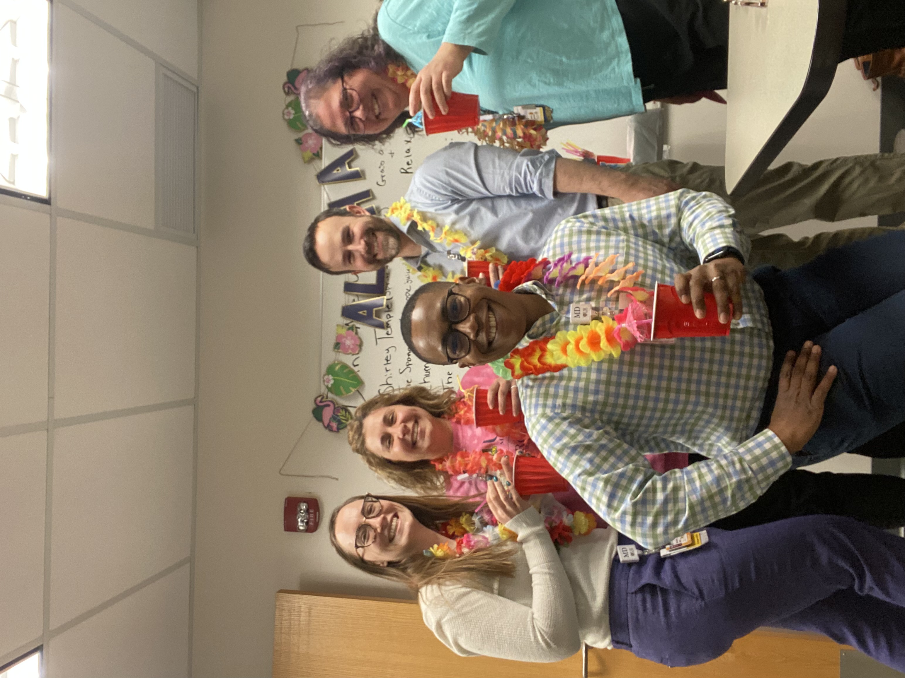 Team members celebrating together at work.