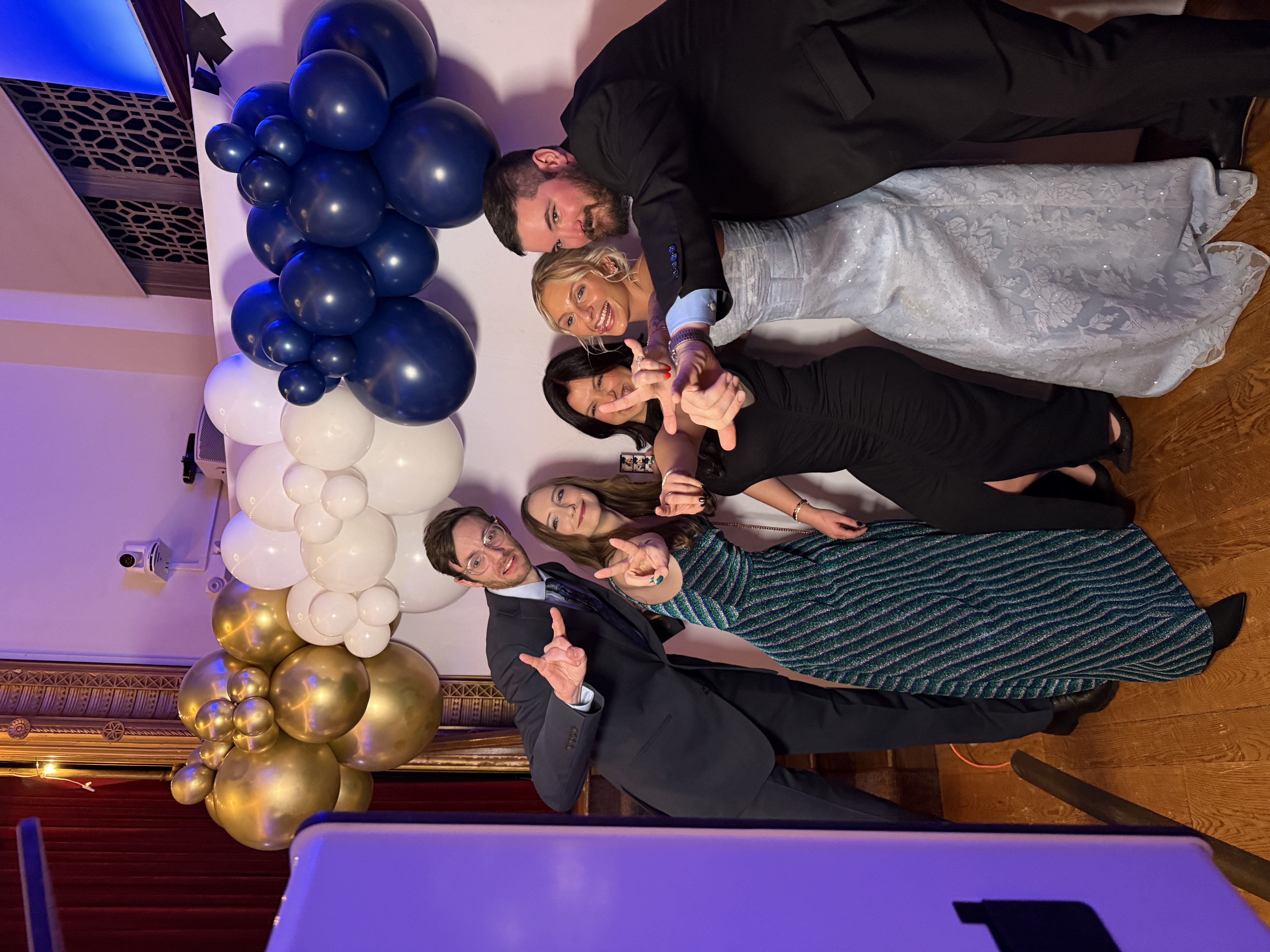 Neurology colleagues posing together at the Winter Ball.