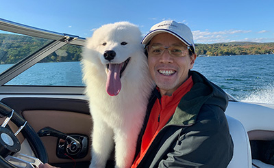 Dr. Lin Having Fun on Canandaigua Lake with His Dog