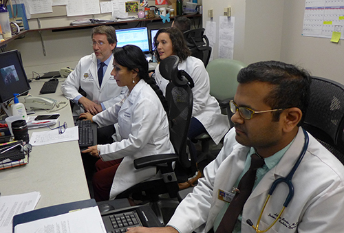 medical fellows looking at computers