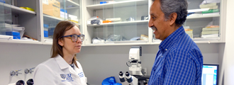 Fellow Kalyna Jakibchuk confers with Dr. Javier Rangel-Moreno in the lab
