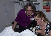Lois VanTol precepting Audra Laing on colposcopy in procedure room at Highland Family Medicine