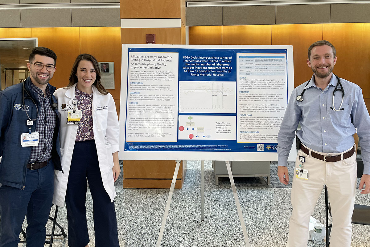 Joshua Borden, MD, Nina Rizk, MD, and Barrett Kemp, MD and third place winning poster at the 2023 Resident Poster Day