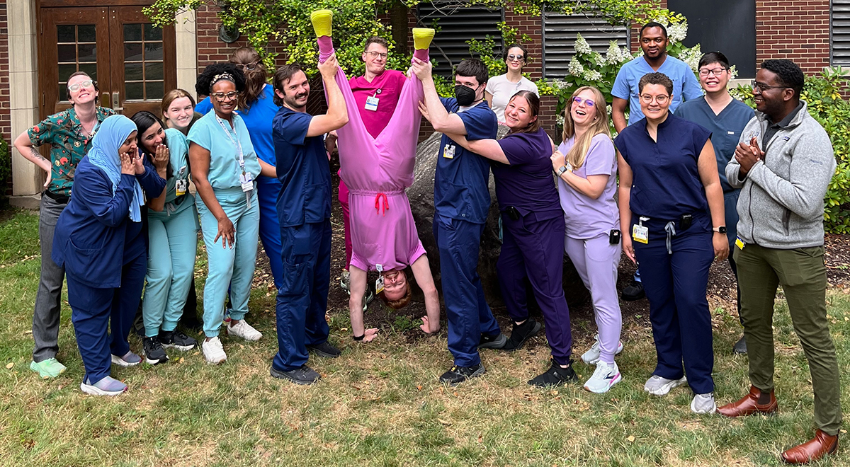 Residents Having Fun Outside, One of them Doing a Handstand