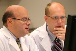 Drs. Brasacchio and Bylund at the computer