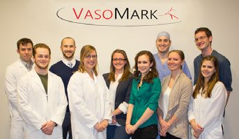 Vasomark group in front of logo