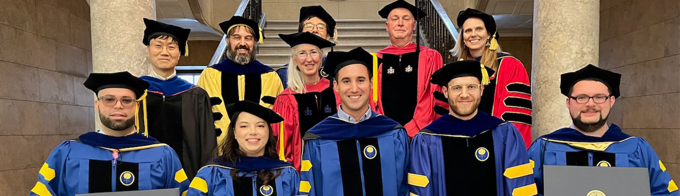 Faculty and students at graduation