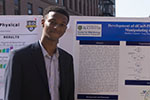 Matthew Auguste with poster