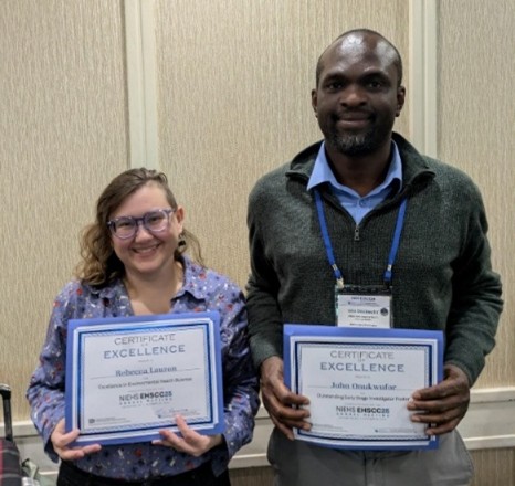 Becca and John holding their awards