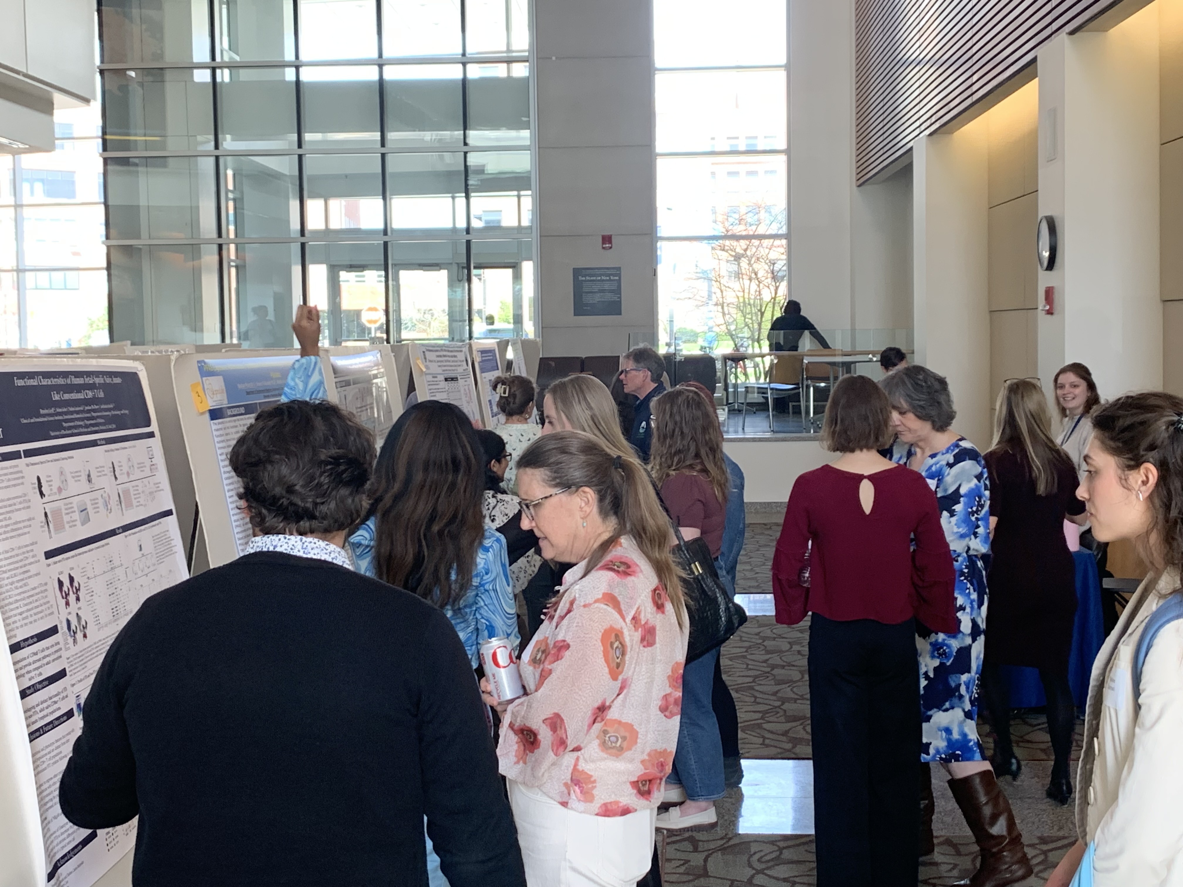 people milling around poster presentations