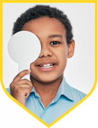child holding paddle over right eye