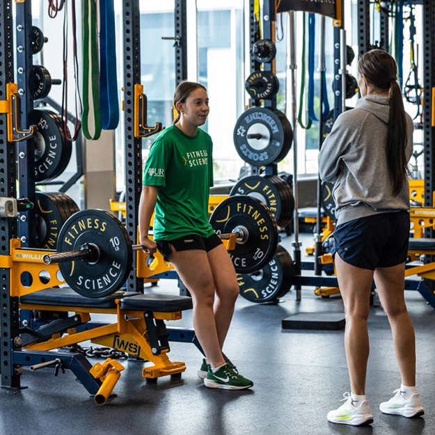 Athlete exercising with weights