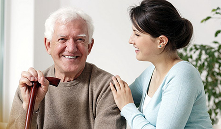 Elderly man with young woman